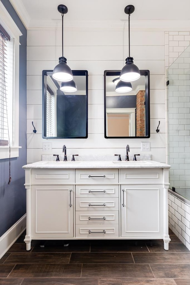 bathroom featuring vanity and ornamental molding