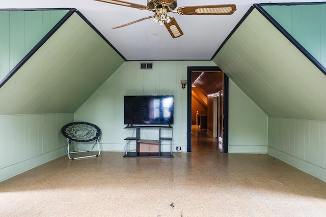 additional living space featuring lofted ceiling and ceiling fan