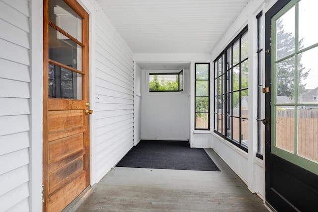 unfurnished sunroom featuring plenty of natural light