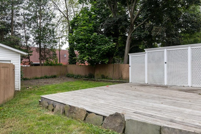 wooden terrace with a yard