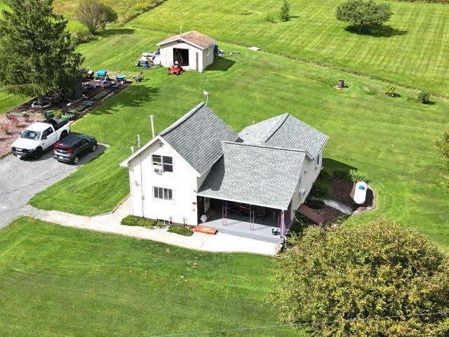 birds eye view of property with a rural view