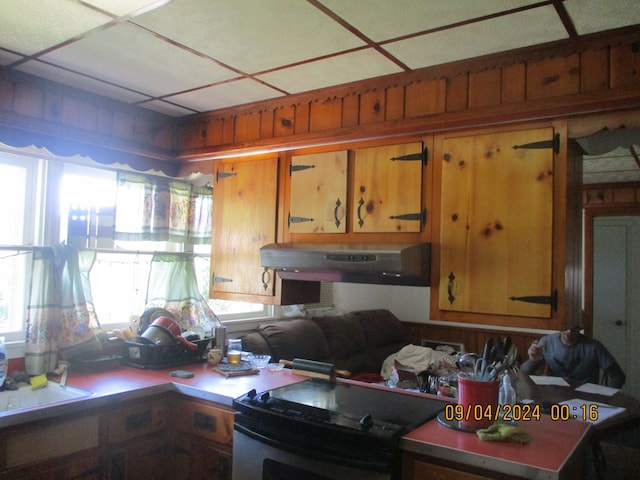 kitchen with black range with electric cooktop and ventilation hood