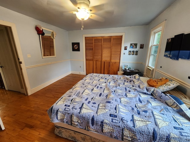 bedroom with a closet, ceiling fan, and hardwood / wood-style flooring