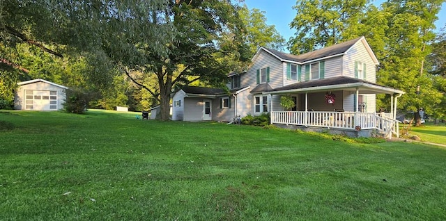 view of side of property with a lawn and covered porch