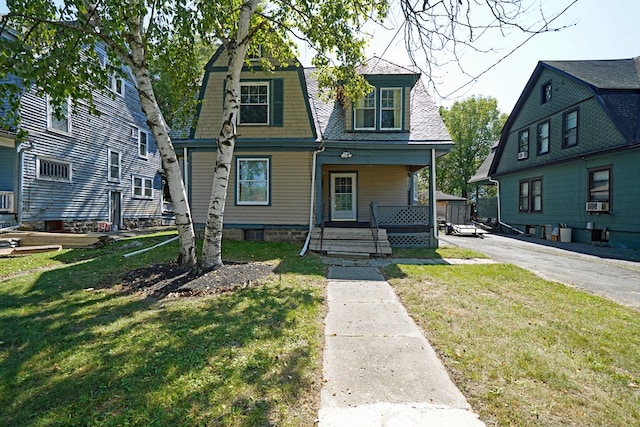 view of front facade with a porch and a front lawn