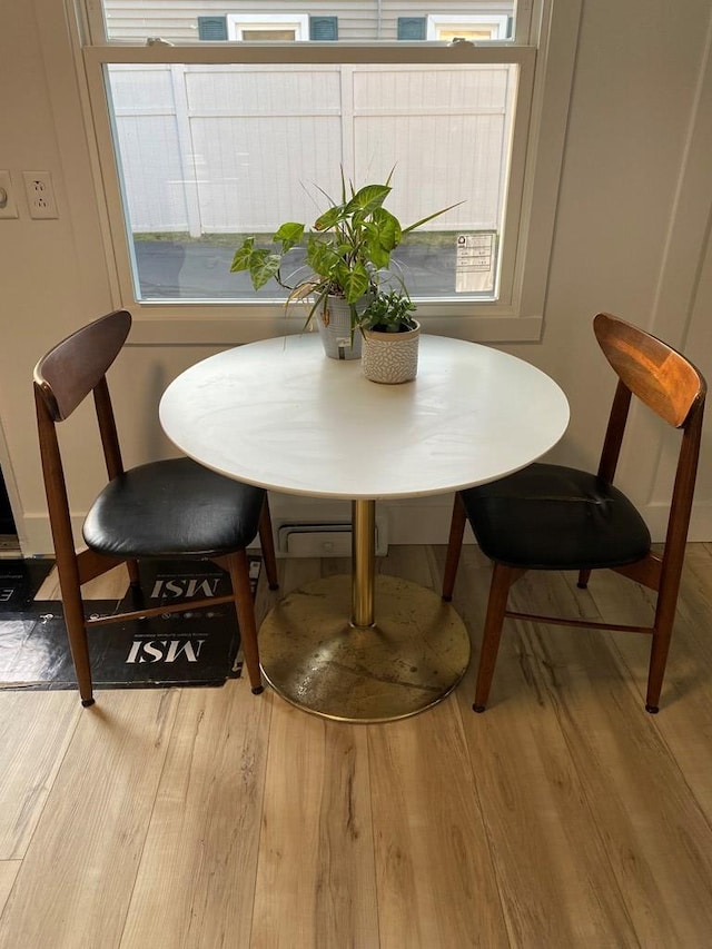 dining area featuring light wood-type flooring