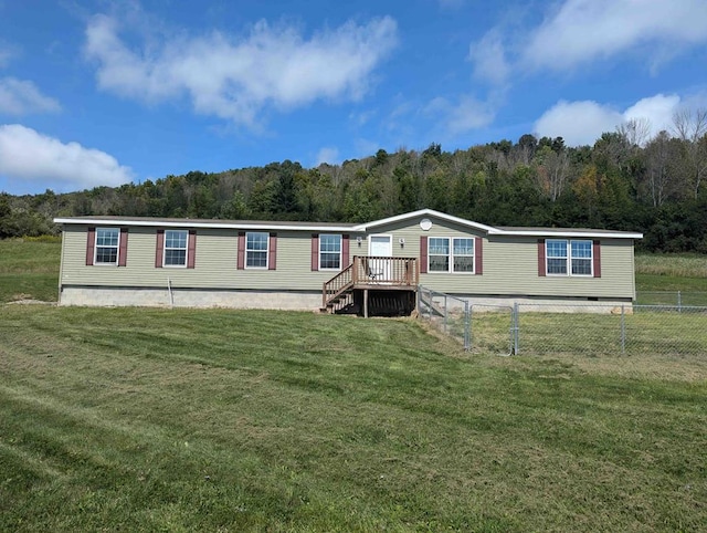 rear view of house with a yard