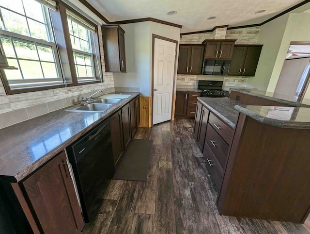 kitchen with sink, dark hardwood / wood-style floors, backsplash, vaulted ceiling, and black appliances