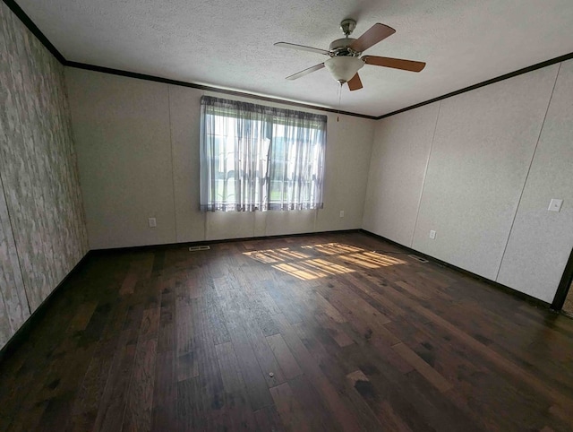 unfurnished room featuring ceiling fan, dark hardwood / wood-style flooring, crown molding, and a textured ceiling