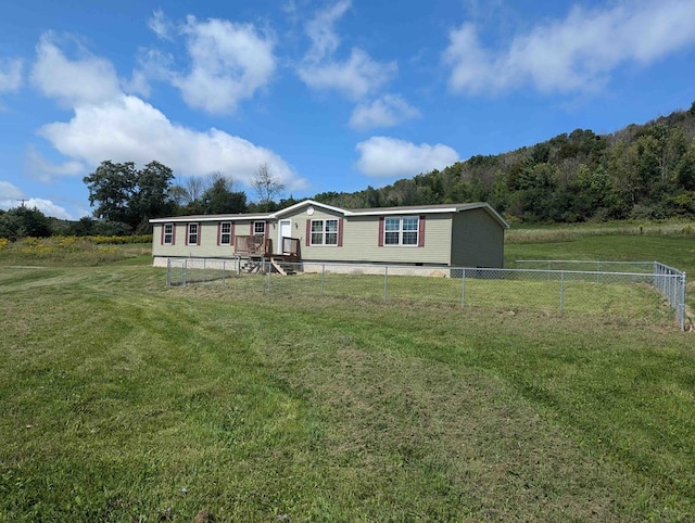 manufactured / mobile home with a front lawn