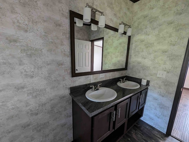 bathroom with vanity and hardwood / wood-style flooring