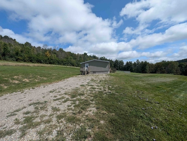 view of yard with a rural view