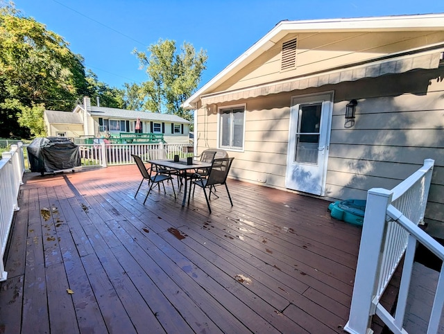 deck featuring a grill