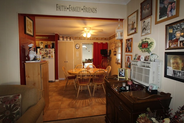 tiled dining area featuring ceiling fan