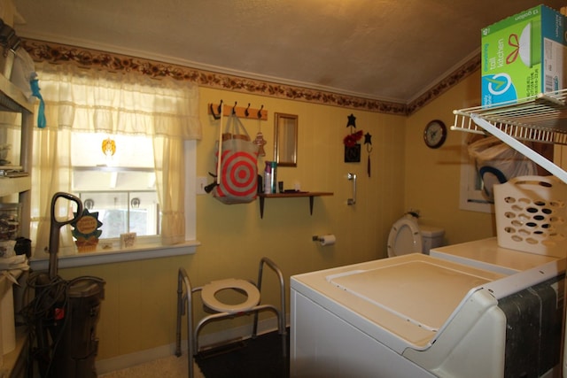 clothes washing area featuring washing machine and clothes dryer