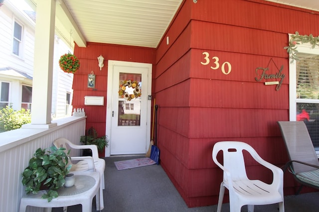 entrance to property with covered porch