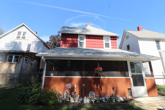 view of front of property with a sunroom