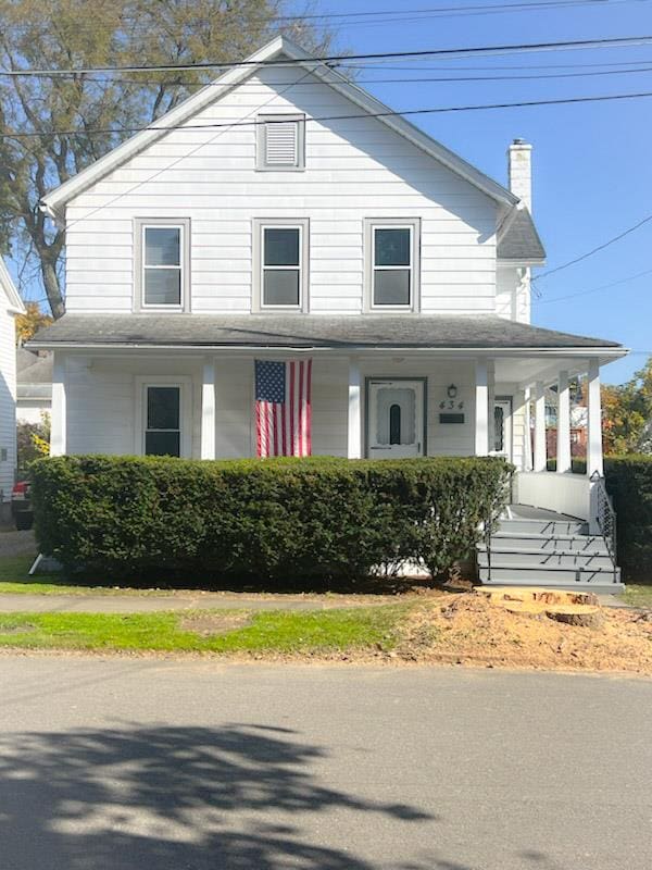 farmhouse inspired home with covered porch