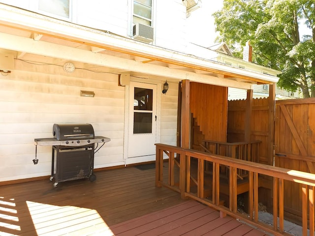 wooden terrace featuring area for grilling and cooling unit