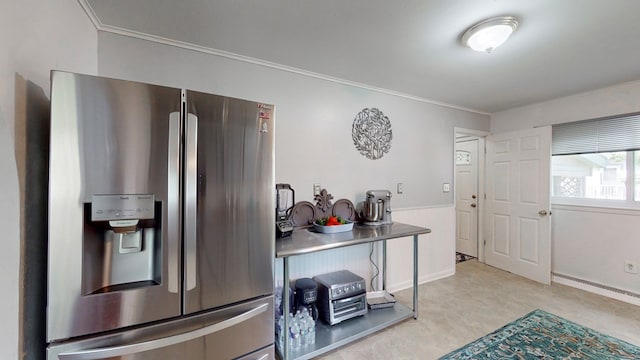 kitchen with stainless steel fridge with ice dispenser and crown molding