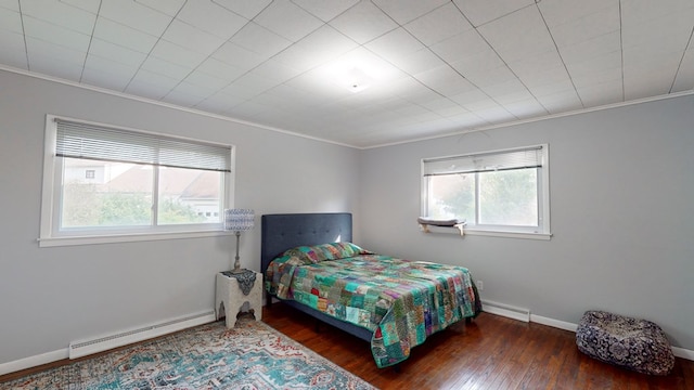 bedroom featuring a baseboard radiator, crown molding, multiple windows, and dark wood-type flooring