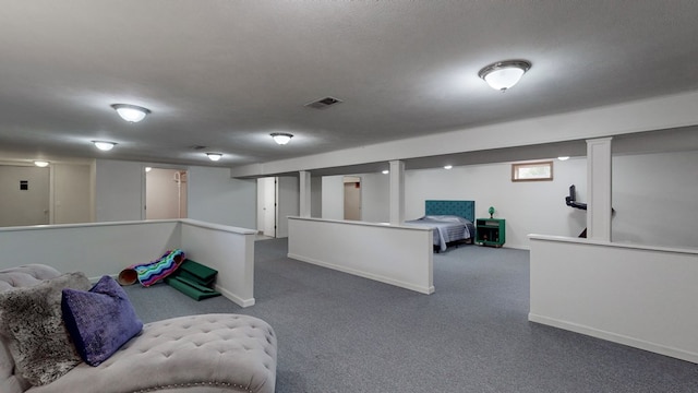 interior space with carpet flooring and a textured ceiling