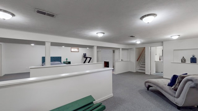 bar with carpet flooring and a textured ceiling