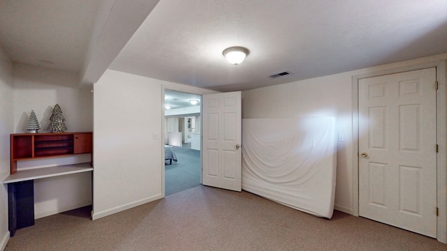 carpeted bedroom with a textured ceiling