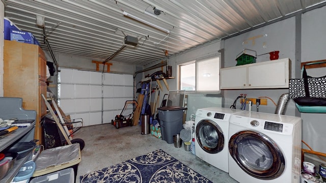 garage with independent washer and dryer and a garage door opener