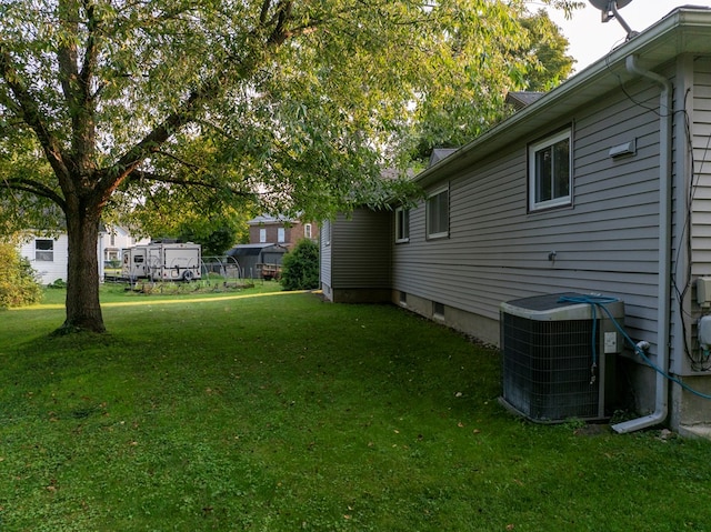 view of yard with central air condition unit