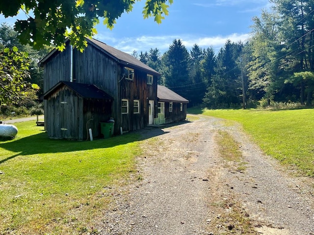 view of side of property featuring a yard