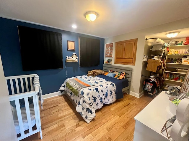 bedroom with light wood-type flooring