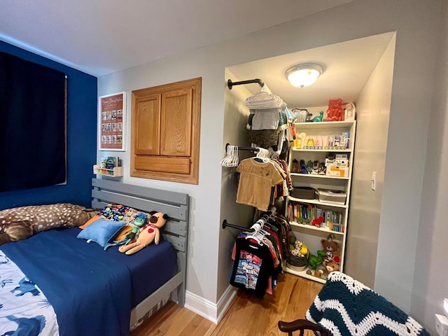 bedroom with light wood-type flooring