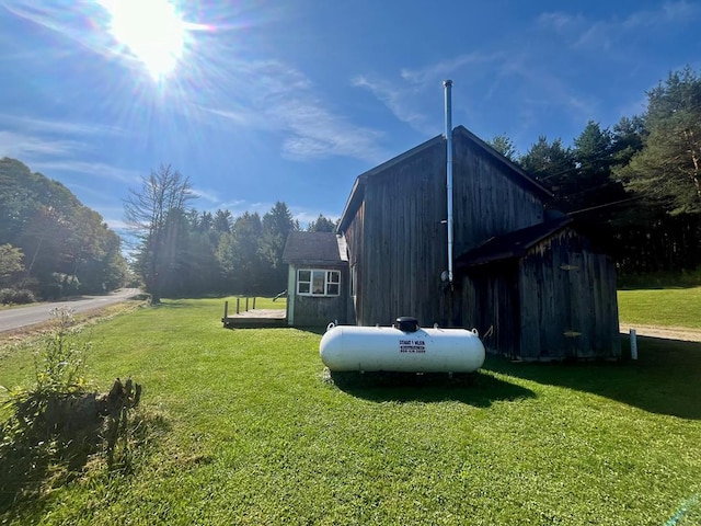 view of side of property featuring a yard