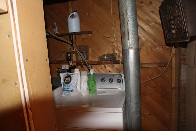 laundry area with washer / clothes dryer and wooden walls