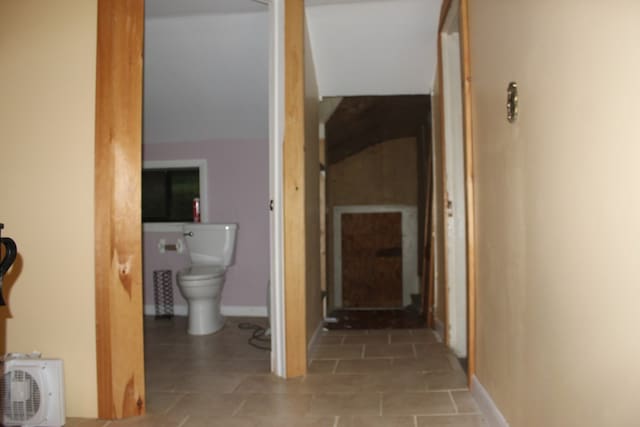 hall featuring tile patterned flooring