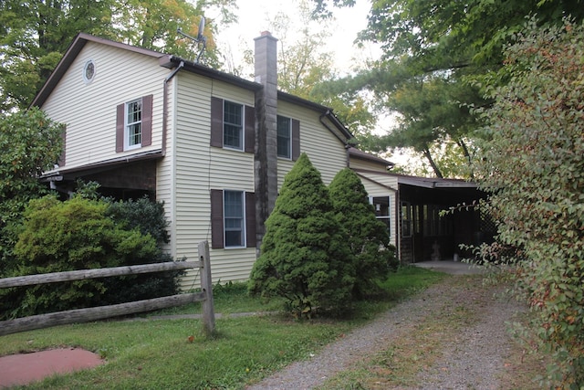 view of property exterior with a carport