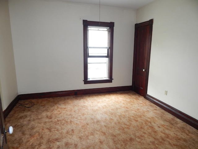 spare room with light colored carpet