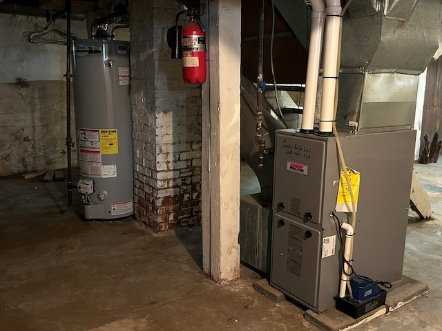 utility room with water heater and heating unit