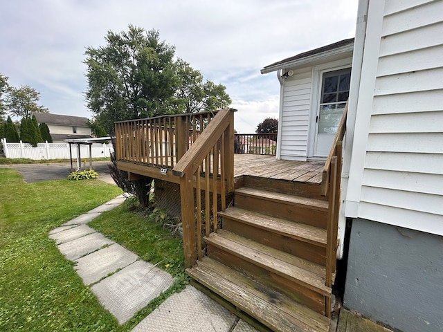 deck featuring a lawn