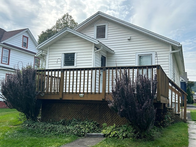 back of property with a wooden deck