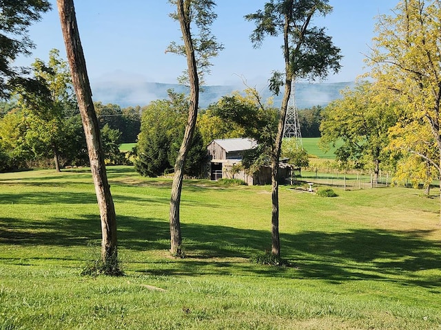 view of property's community with a lawn