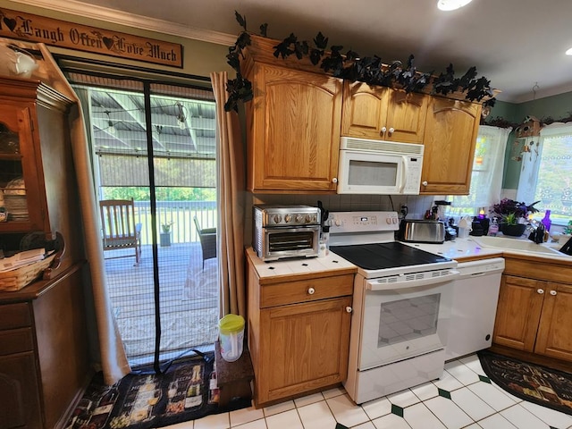 kitchen with decorative backsplash, white appliances, ornamental molding, and light tile patterned floors