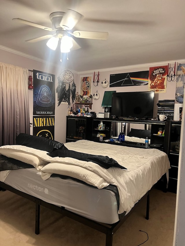 bedroom with ceiling fan, ornamental molding, and carpet