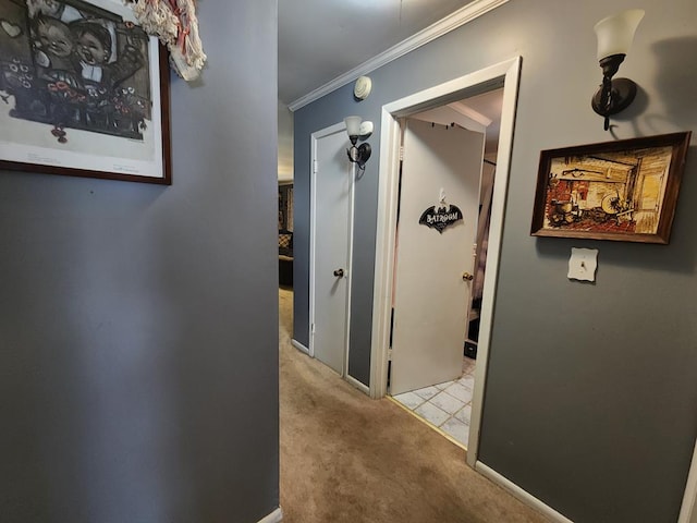 hallway featuring light carpet and ornamental molding