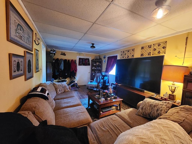 living room with a paneled ceiling and hardwood / wood-style floors