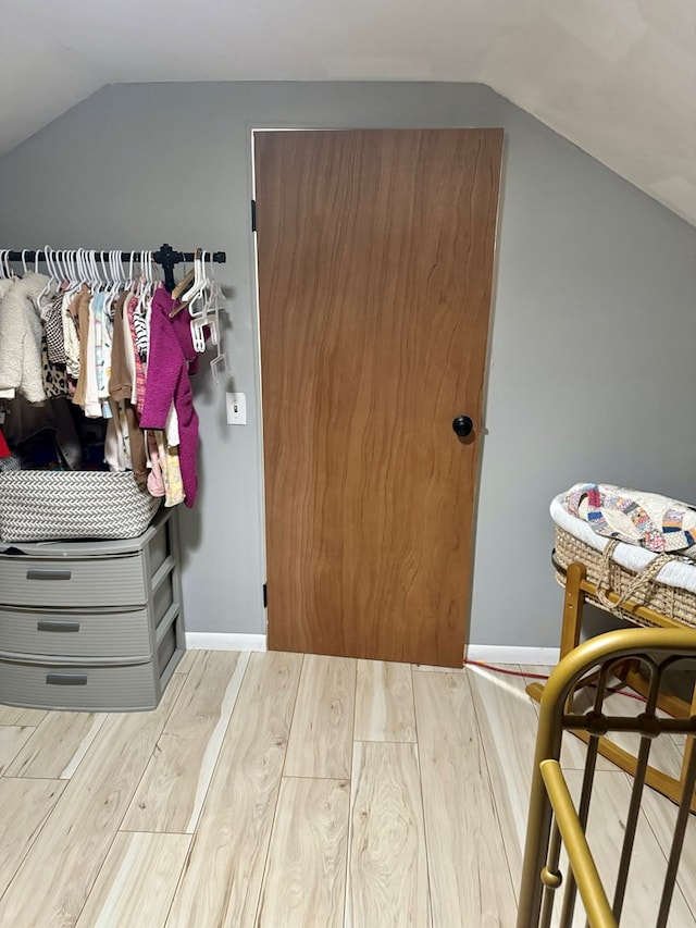 bedroom with lofted ceiling