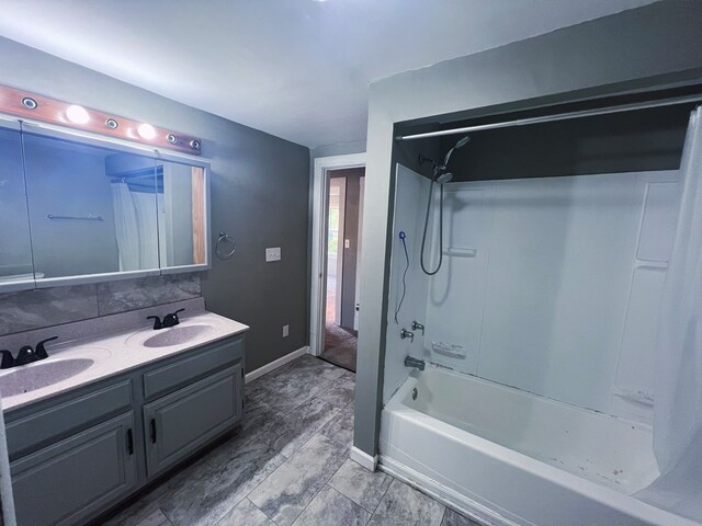 bathroom featuring shower / tub combo and vanity