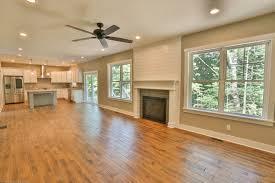 unfurnished living room featuring light hardwood / wood-style flooring and ceiling fan