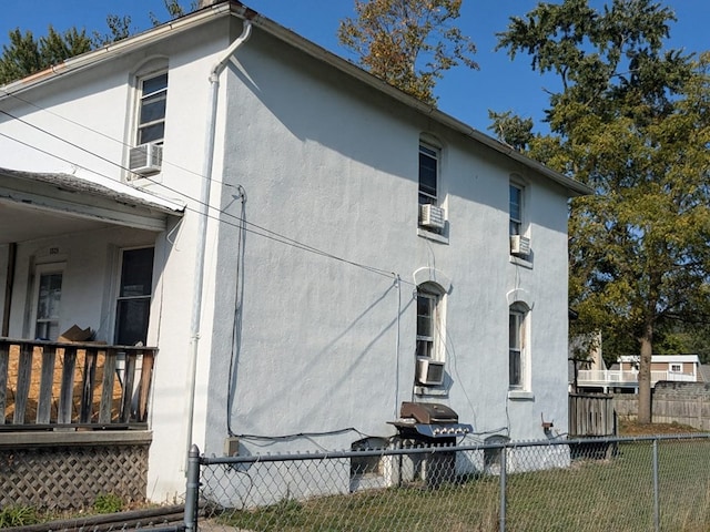 view of side of home with cooling unit